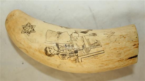 A scrimshaw whales tooth, 5.5in.